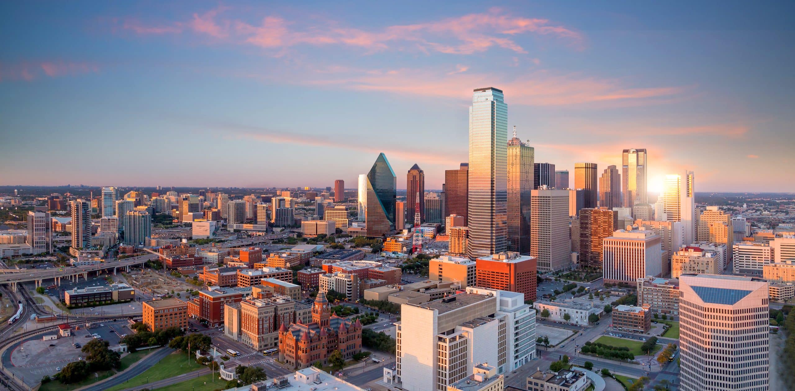 Dallas, Texas cityscape with blue sky at sunset